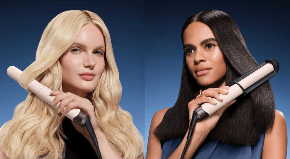 Two women styling hair with straighteners against a blue background.
