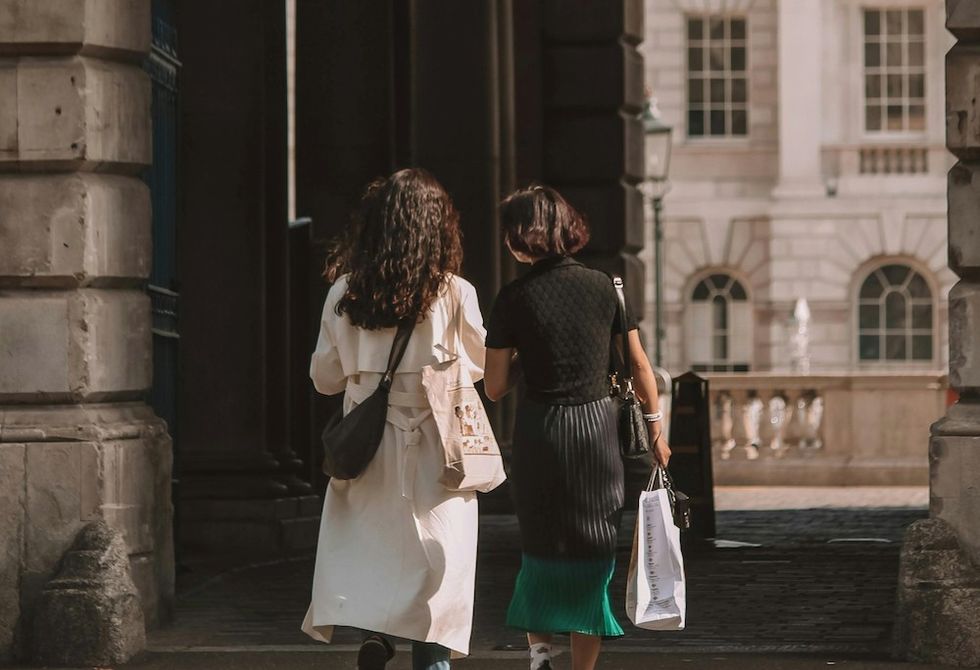 two women walking around london