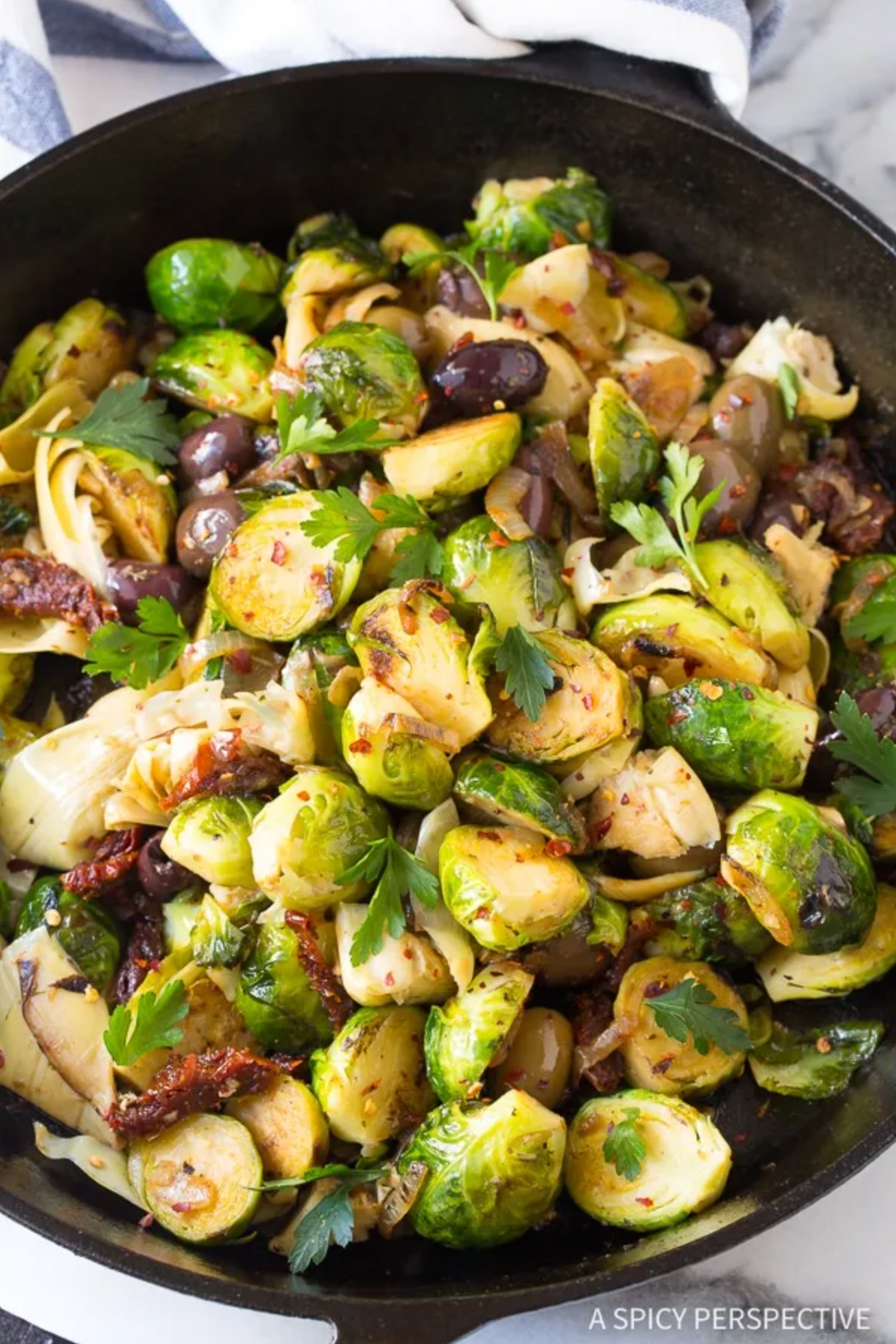 \u200bBraised Brussels Sprouts with Sun-Dried Tomatoes, Artichokes, and Olives