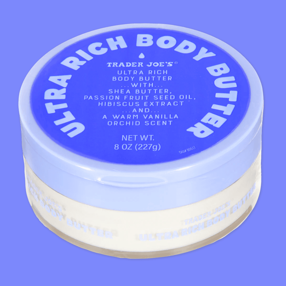 \u200bTrader Joe's Ultra Rich Body Butter on a bright blue background.
