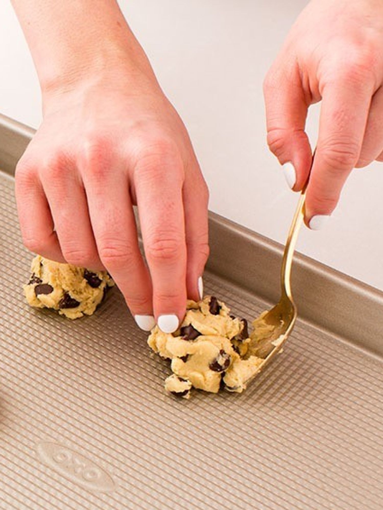 unbaked cookies on a baking sheet