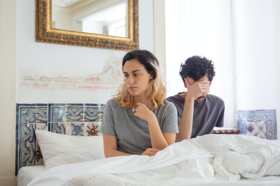 upset couple in bed
