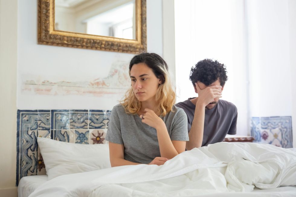 upset couple in bed