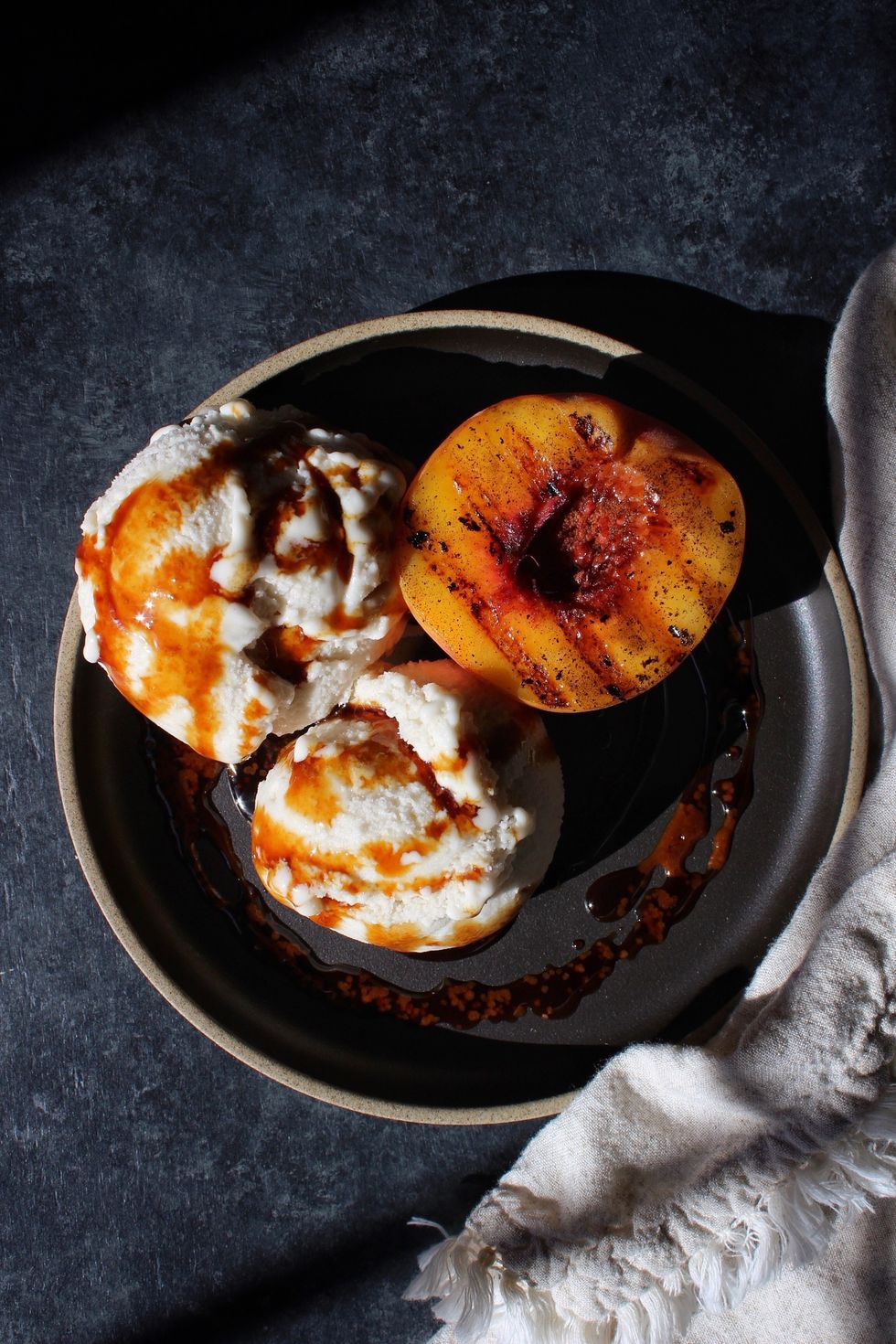 Vanilla-Bourbon Ice Cream with Grilled Peach + Caramel Sauce