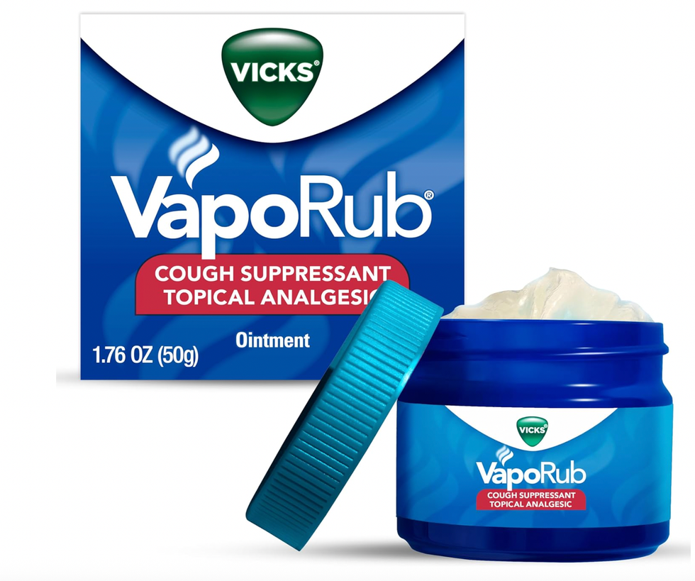 Vicks VapoRub container with open lid, box behind, labeled "Cough Suppressant Topical Analgesic".