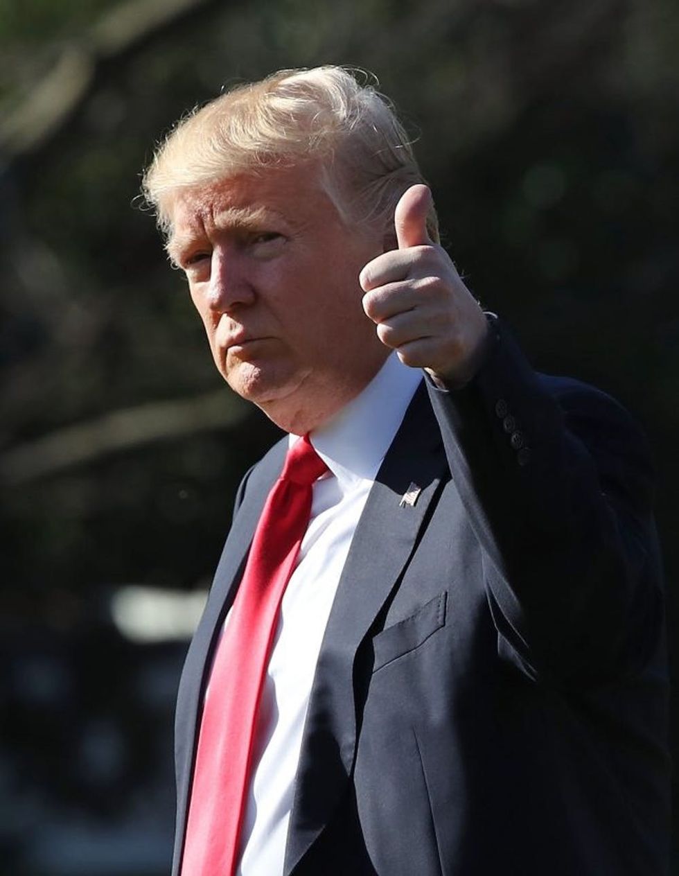 WASHINGTON, DC - FEBRUARY 24: U.S. President Donald Trump gestures as he walks toward Marine One before departing from the White House on February 24, 2017 in Washington, DC. President Trump is making the short trip to National Harbor in Maryland to speak at CPAC the Conservative Political Action Conference. (Photo by Mark Wilson/Getty Images)