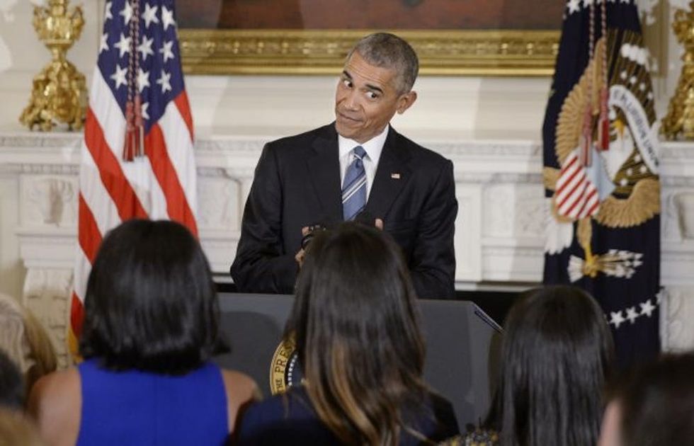 WASHINGTON, DC - JANUARY 12: (AFP OUT) U.S. President Barack Obama looks at his wife Michelle and his daughters Malia and Sasha during an event in the State Dining room of the White House, January 12, 2017 in Washington, DC. Obama presented the Medal of Freedom to Vice President Joe Biden. (Photo by Olivier Douliery-Pool/Getty Images)