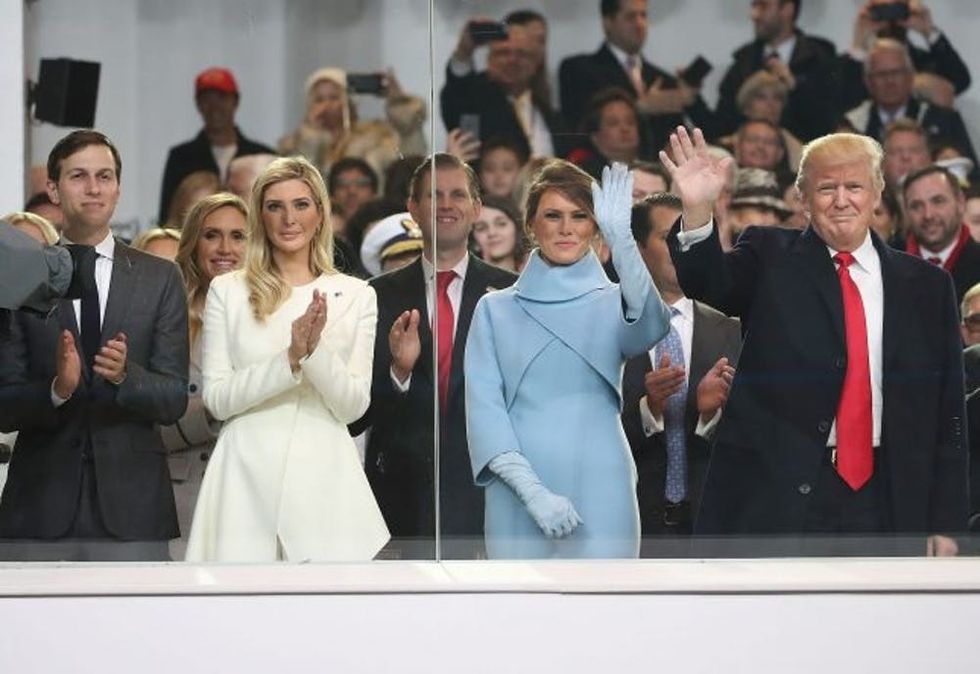 WASHINGTON, DC - JANUARY 20: U.S. President Donald Trump (R), stands with his wife first lady Melania Trump, daughter Ivanka Trump and her husband Jared Kushner, inside of the inaugural parade reviewing stand in front of the White House on January 20, 2017 in Washington, DC. Donald Trump was sworn in as the nation's 45th president today. (Photo by Mark Wilson/Getty Images)