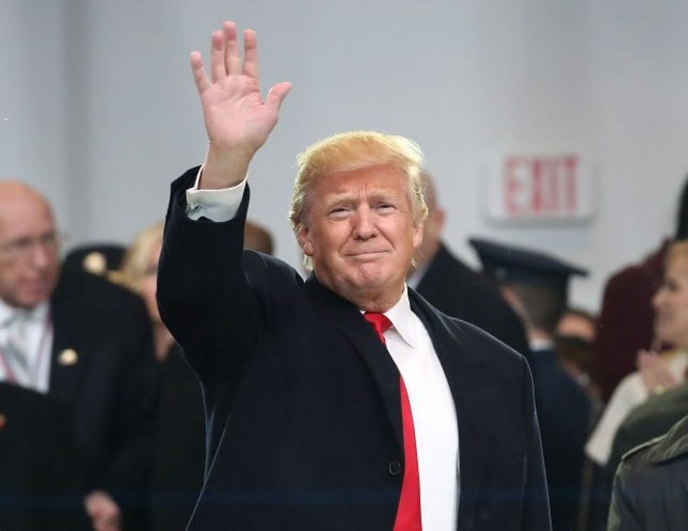 WASHINGTON, DC - JANUARY 20: U.S. President Donald Trump waves to the crowd from the inaugural parade reviewing stand in front of the White House on January 20, 2017 in Washington, DC. Donald Trump was sworn in as the nation's 45th president today. (Photo by Mark Wilson/Getty Images)