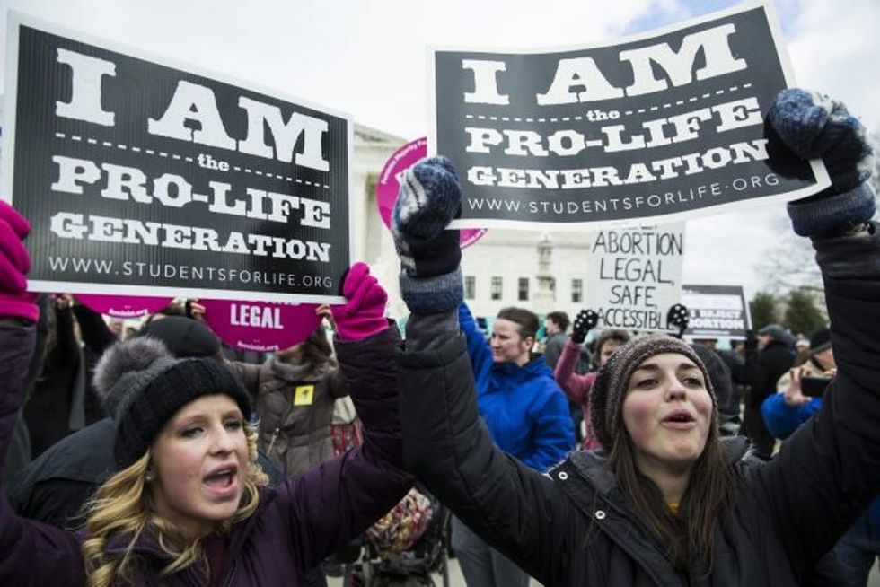 WASHINGTON, USA - JANUARY 27: Pro-Life demonstrators try to block Pro-Choice supporters in front of the Supreme Court during the annual March for Life on the anniversary of the historic Roe v. Wade Supreme Court ruling in Washington, USA on January 27, 2017. (Photo by Samuel Corum/Anadolu Agency/Getty Images)
