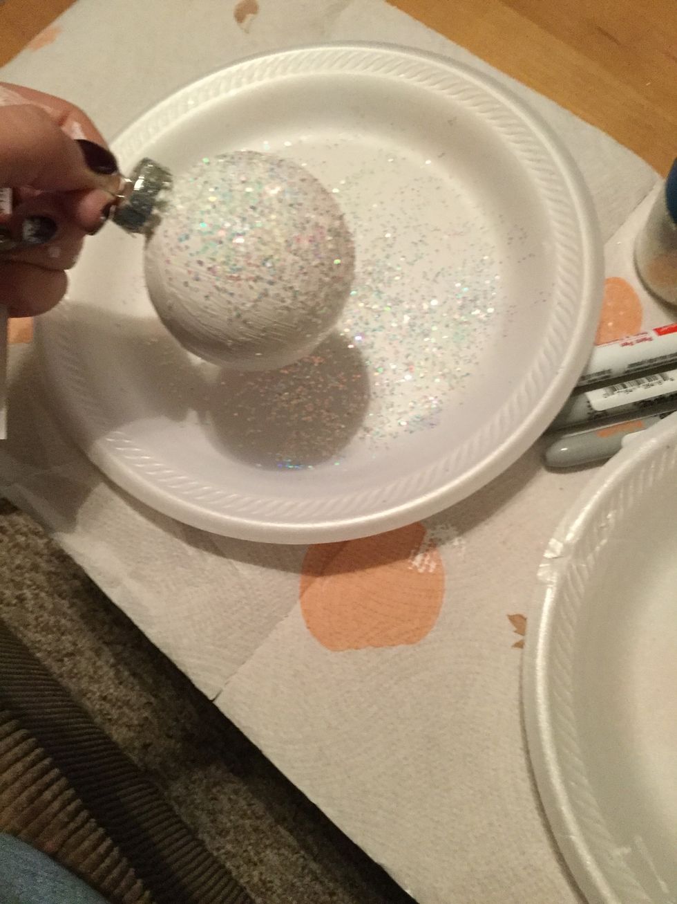 While paint is still wet begin shaking glitter onto it ( this step is optional)