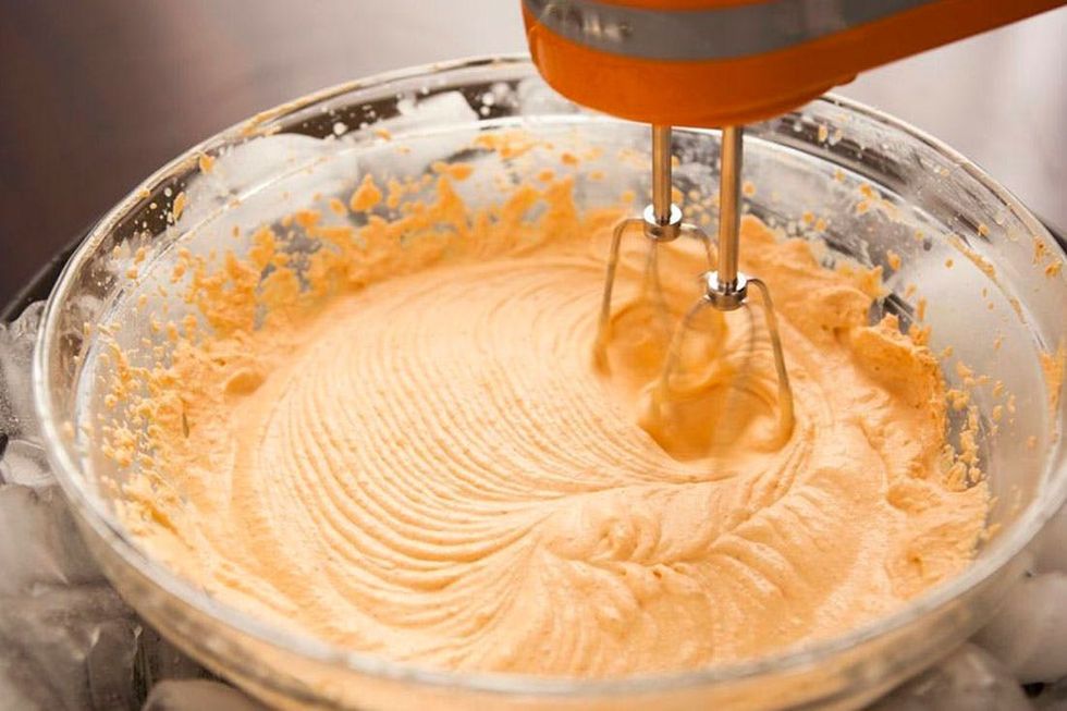 whisking pumpkin puree