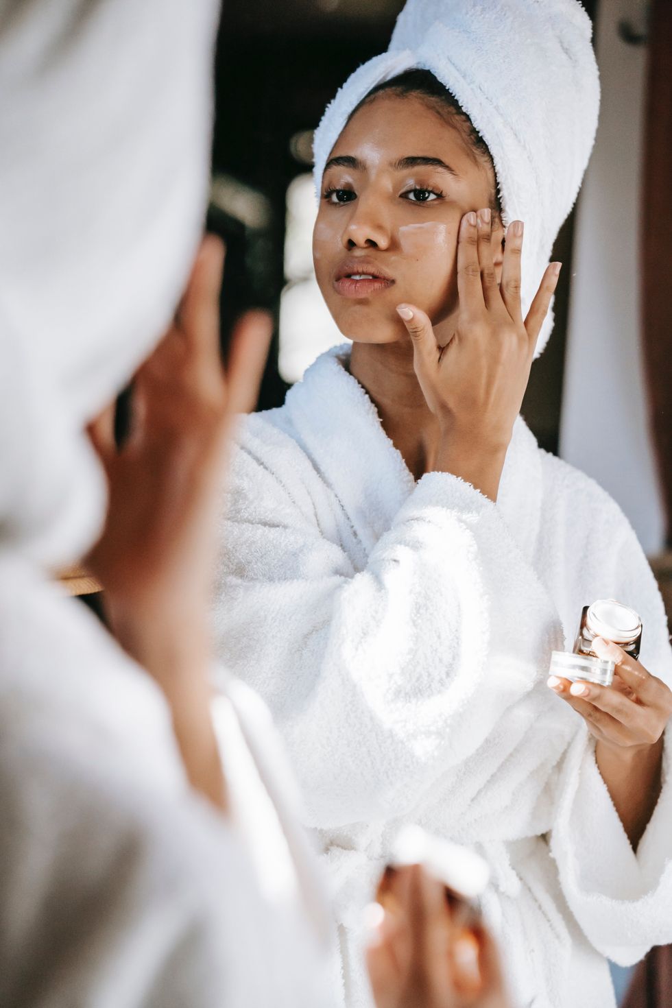 woman applying skincare