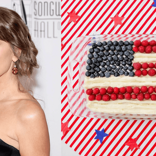 Woman at event and a cake decorated as the American flag with berries.