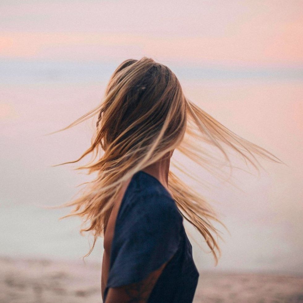 woman at the beach at sunset