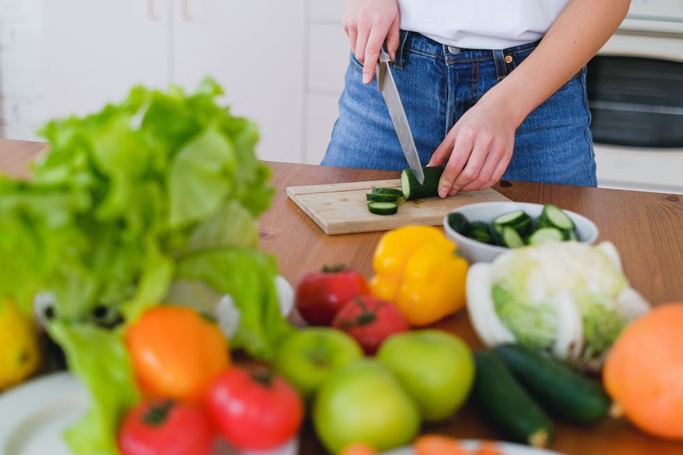woman chopping cucumber anti inflammatory diet explained
