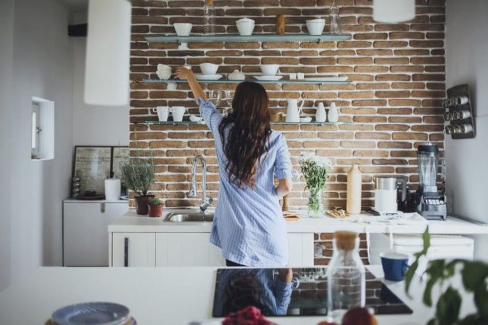 Woman Cleaning Kitchen