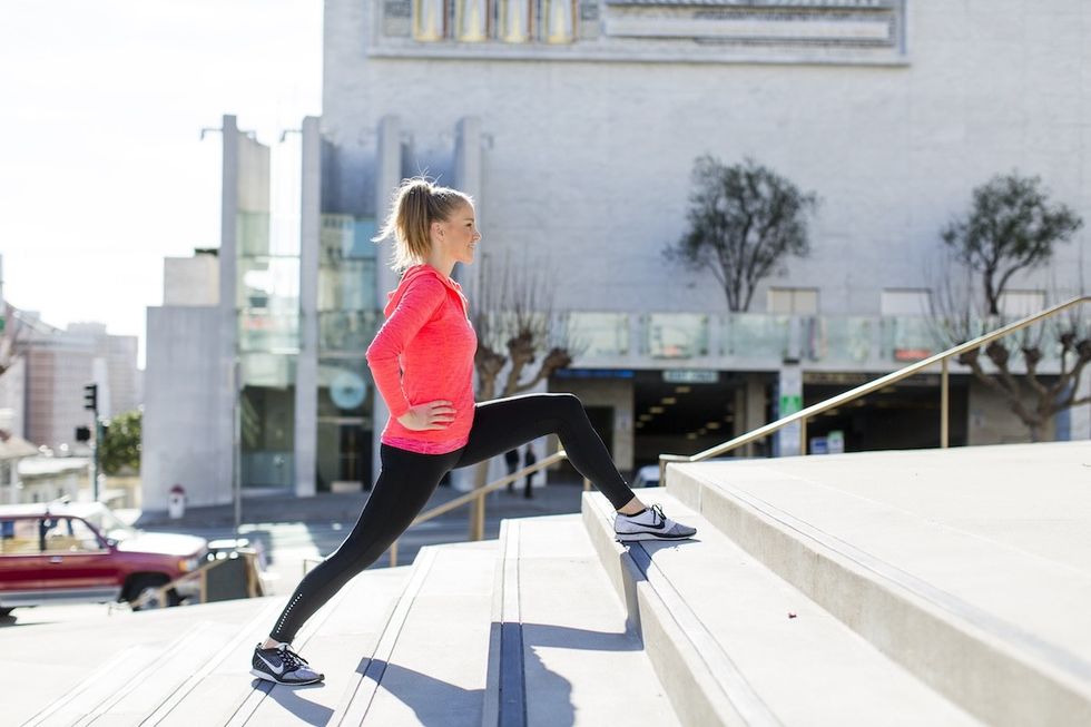 woman climbing up stairs
