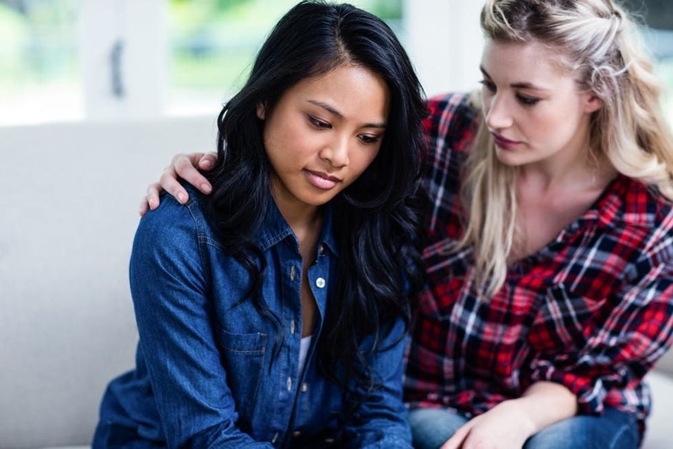 Woman comforting her friend