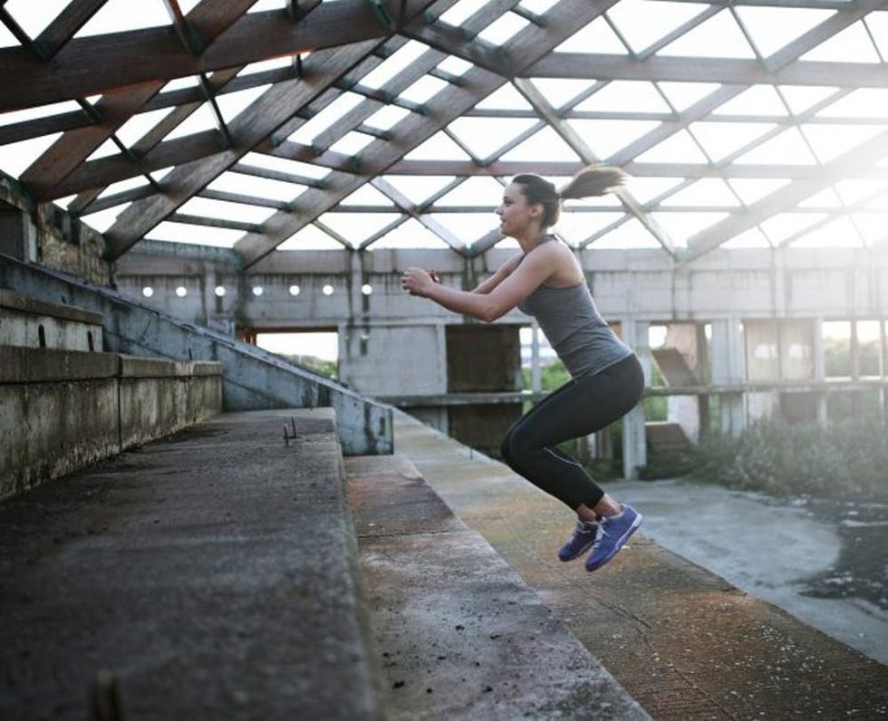 woman doing a gym exercise on stairs