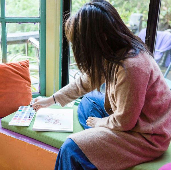 woman doing calligraphy