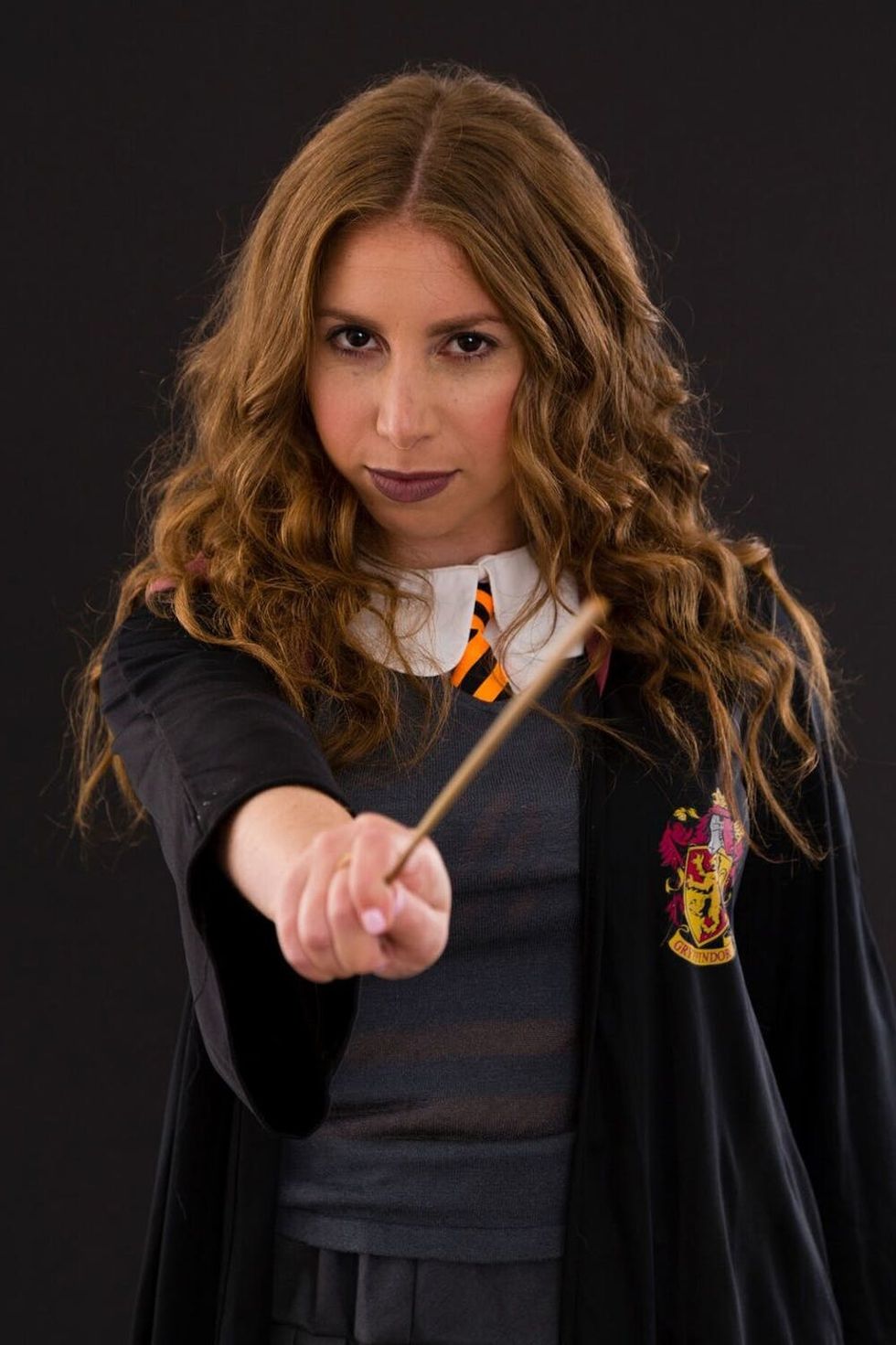 Woman dressed up as Hermione from Harry Potter for Halloween. 