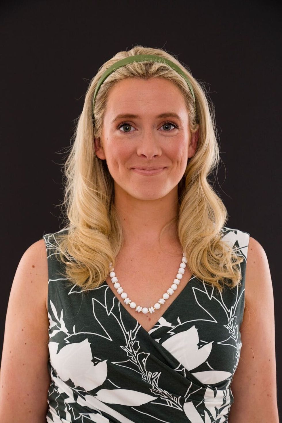 Woman dressed up as the witch from Bewitched for Halloween. 