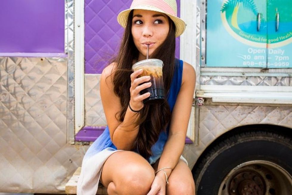 Woman drinking ice coffee