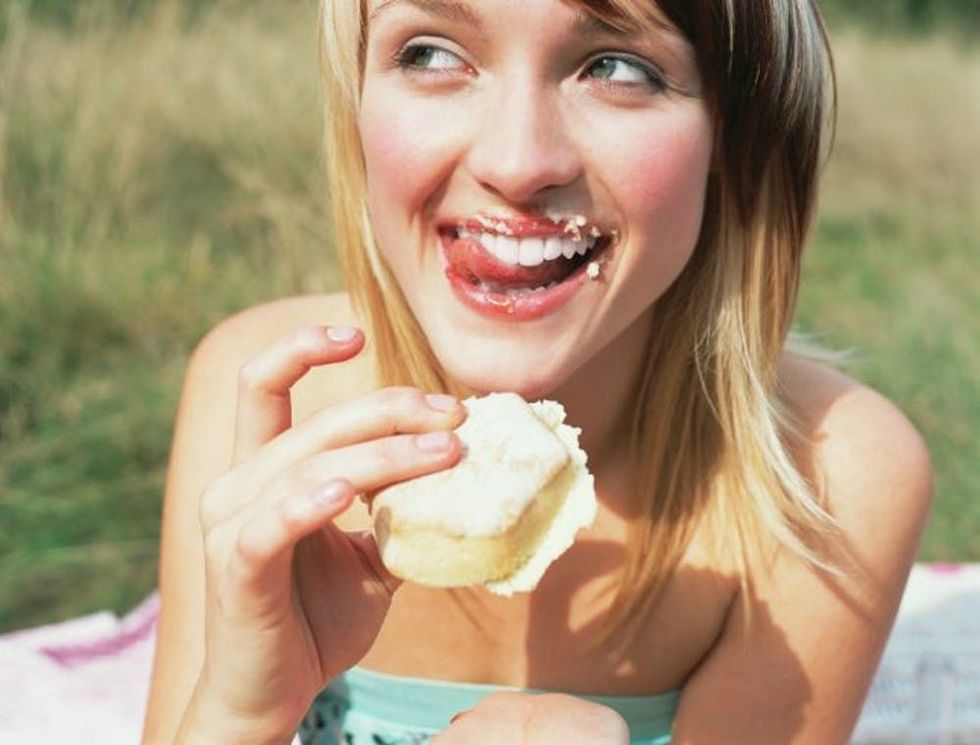 woman eating dessert