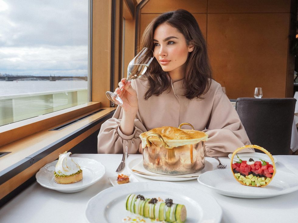 woman eating meal on cruise birthday trip ideas