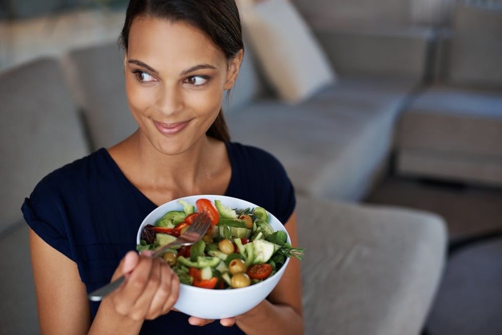 Woman eating salad
