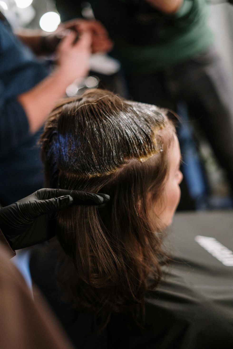 woman getting her hair dyed