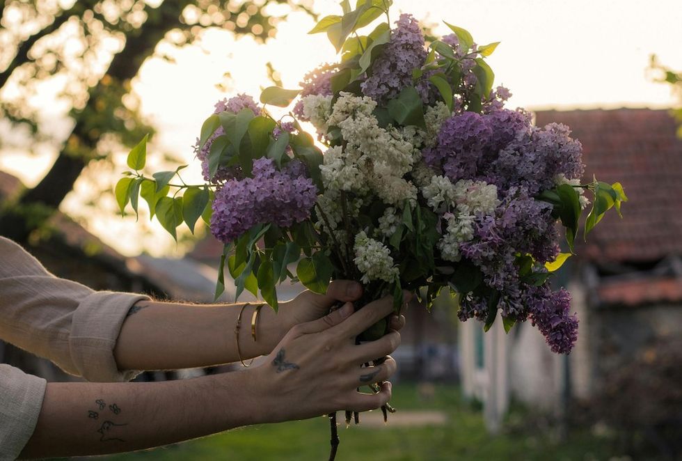 woman holding a bouquet of flowers