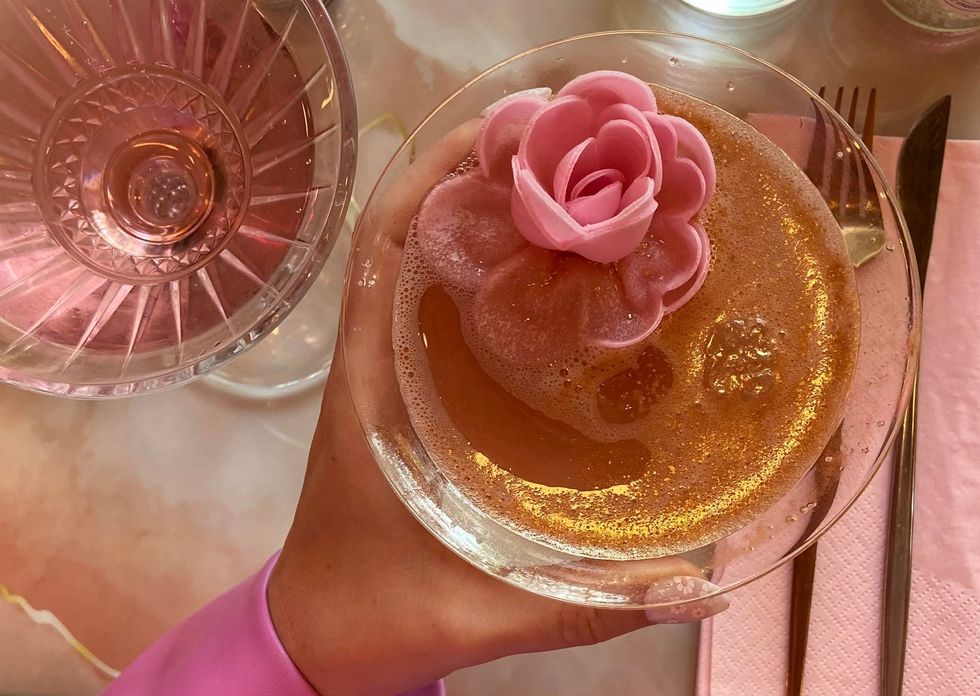 woman holding a valentine's day cocktail