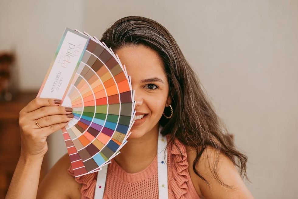 woman holding color swatches