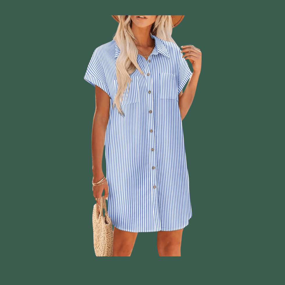 Woman in a blue striped dress holding a straw bag.