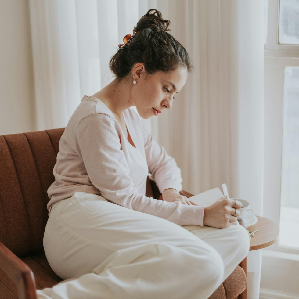 Woman In Chair Journaling