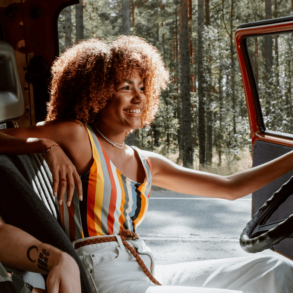 Woman in drivers seat of car