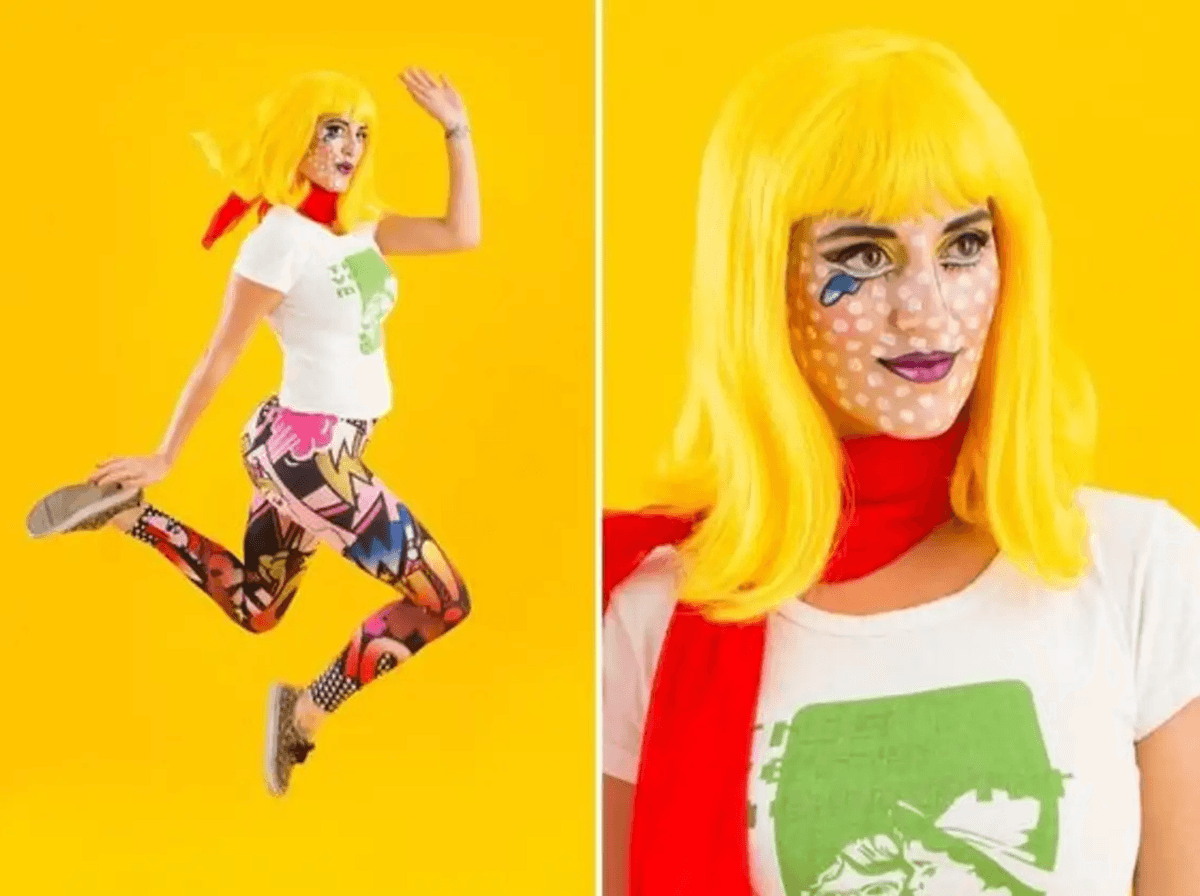 Woman in pop art makeup and colorful leggings jumps against a yellow background.