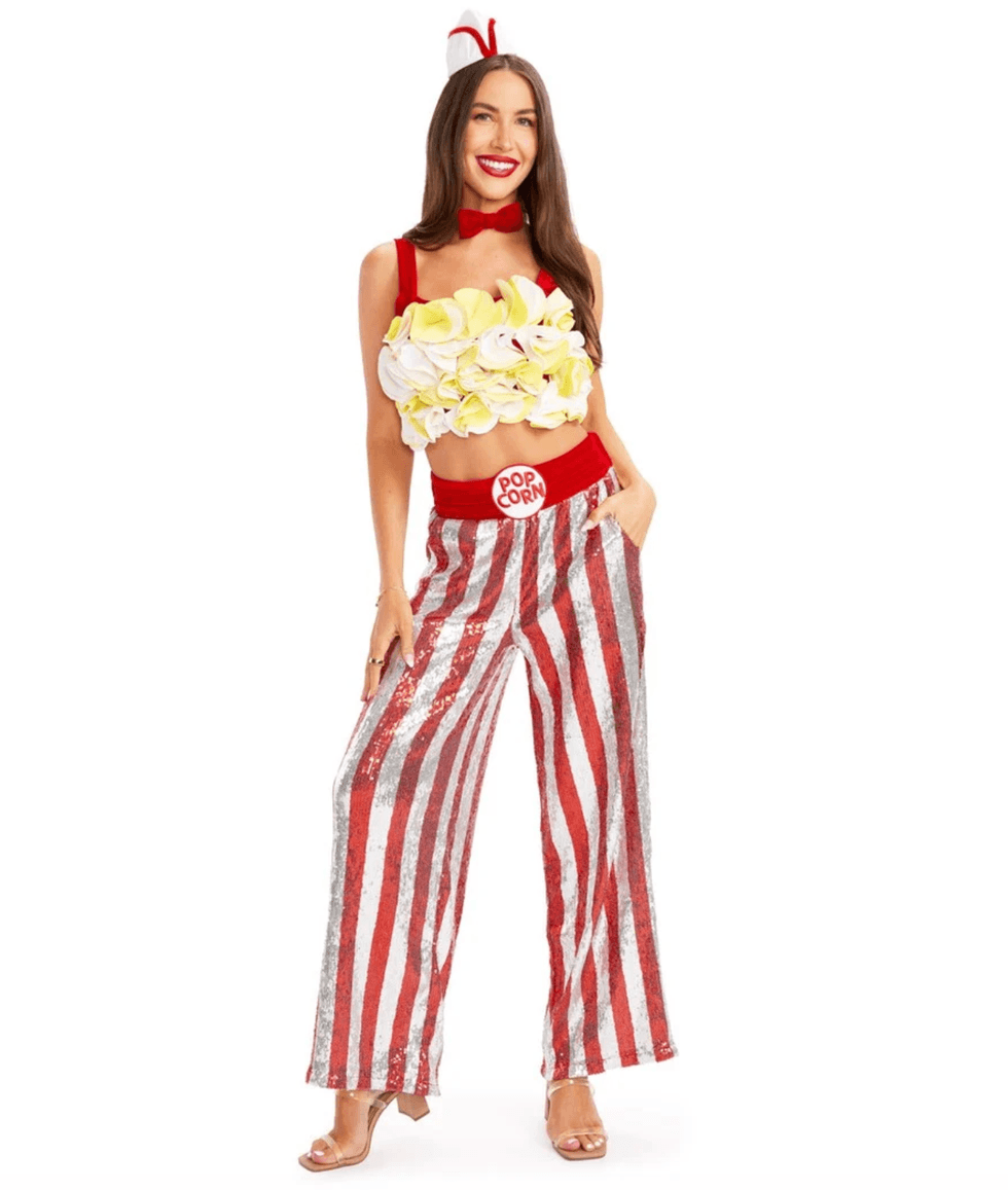 Woman in popcorn-themed costume with red stripes and floral top.
