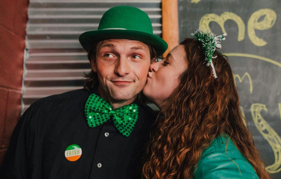 woman kissing man on cheek on st patrick's day