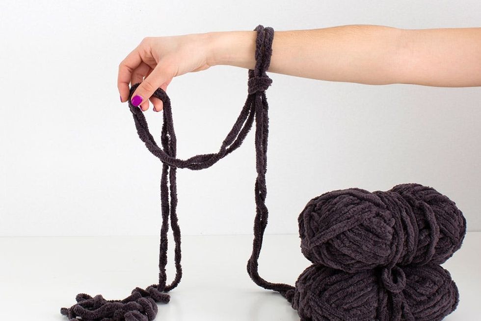 woman knitting a scarf