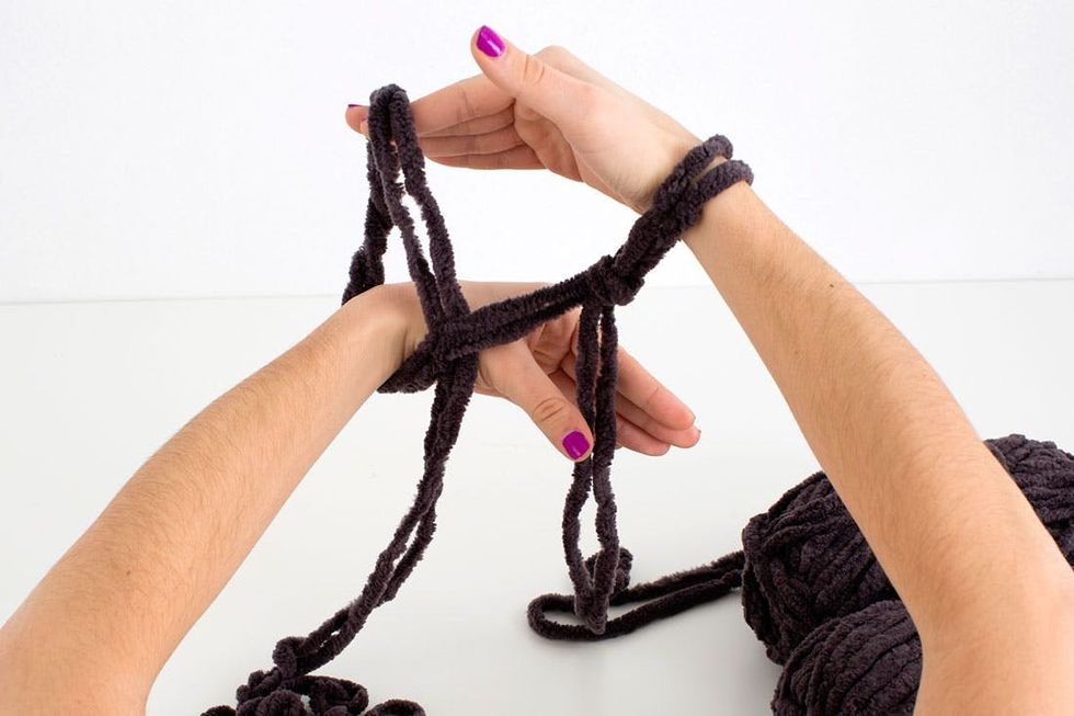 woman knitting a scarf