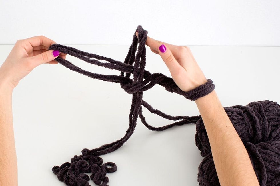 woman knitting a scarf