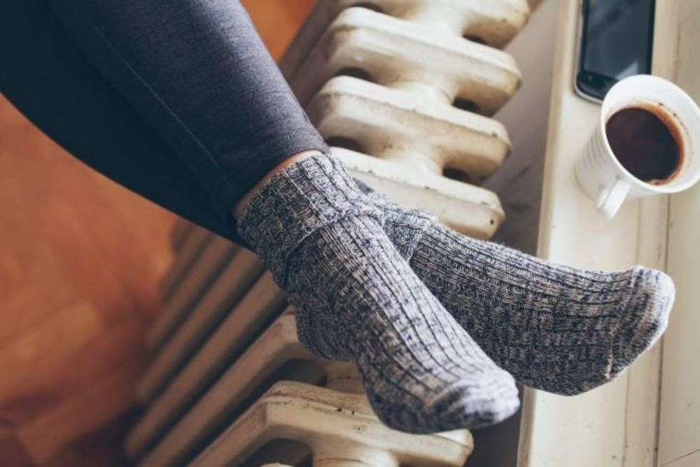 woman legs on radiator