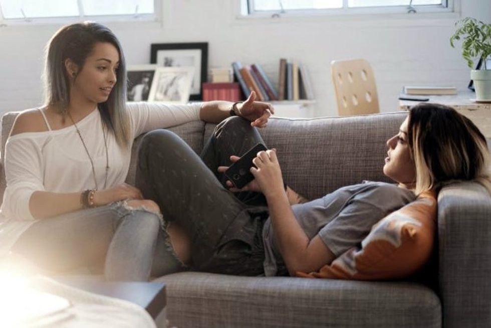 woman lesbian couple couch header Cropped