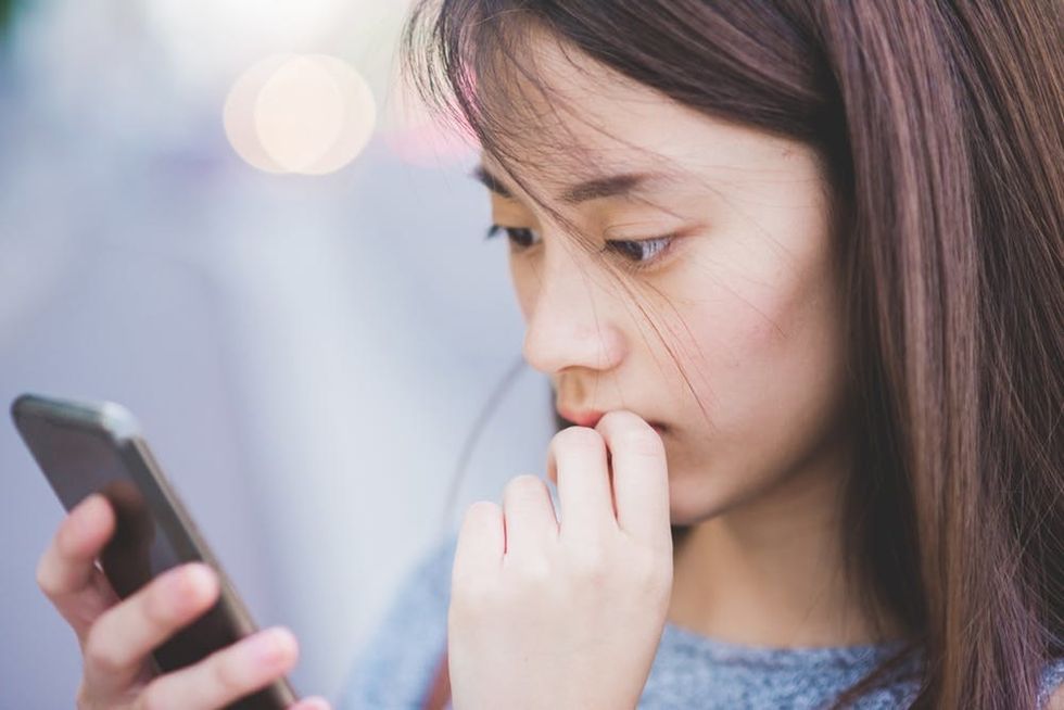 Woman looking at smartphone