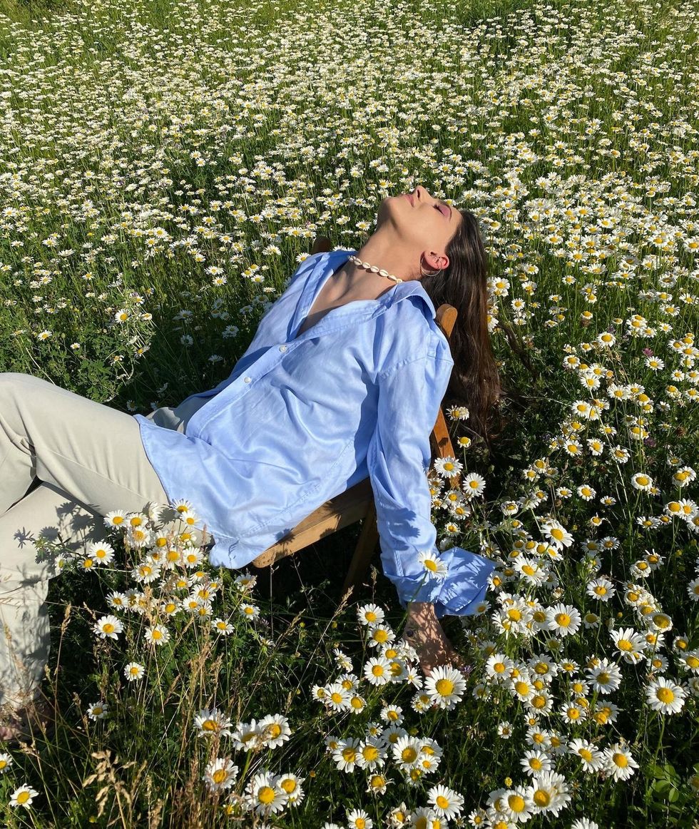 woman lounging in flower field