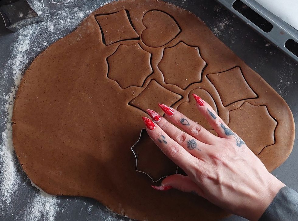 woman making gingerbread cookies