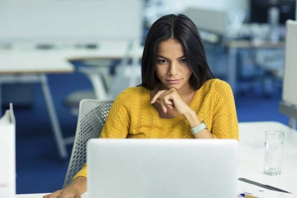 woman office using laptop computer